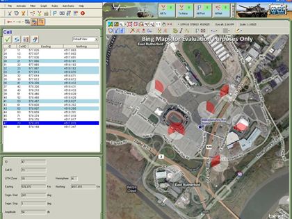 GenCOM UI++ GSM cell view with cell sectors and coverage arcs over an urban area