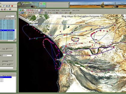 GenCOM UI++ network view with communication network footprints drawn over terrain